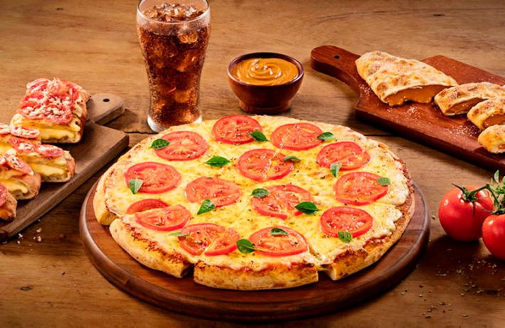 Pesquisa do IBGE mostra pizza mais presente entre mais ricos Foto: Divulgação, Dominos